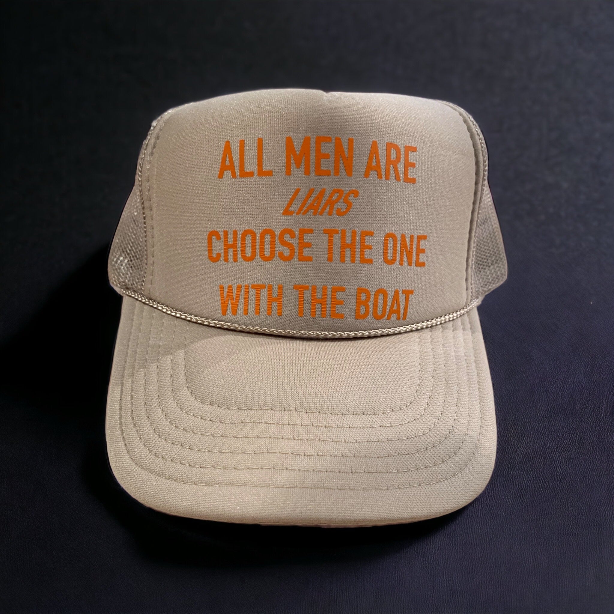 All Men Are Liars Pick One That Has A Boat All Men Are Liars Trucker Hat