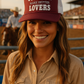 Cowboys make better lovers Trucker Hat