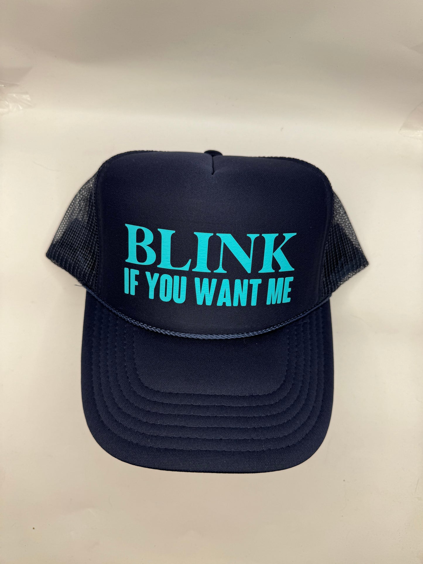 "Blink if you want me" Trucker Hat
